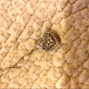 Silver heart locket with diamonds